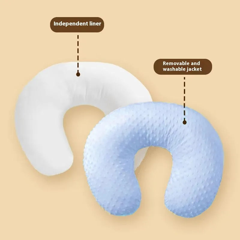 Pink nursing pillow with removable cover for breastfeeding and bottle feeding support.