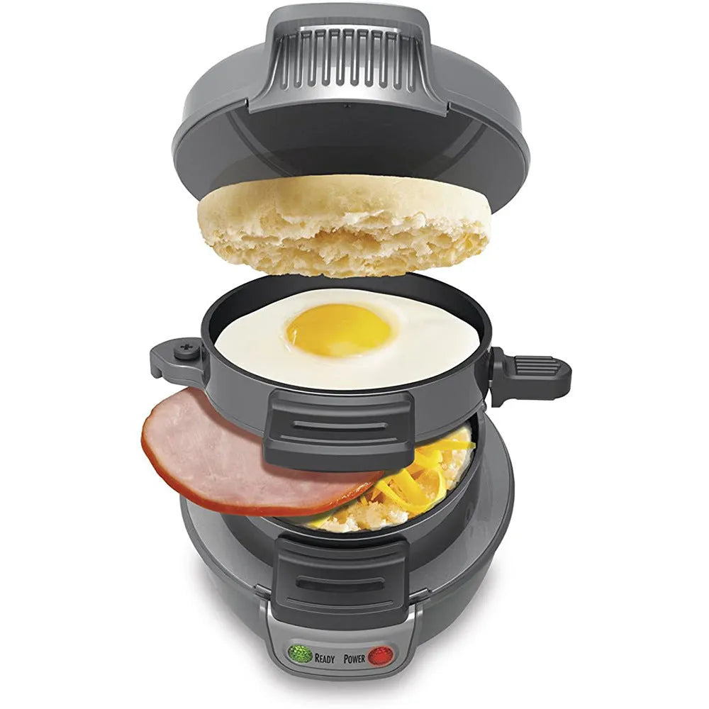 Bright red breakfast sandwich maker with egg cooker ring and waffle plates on kitchen counter