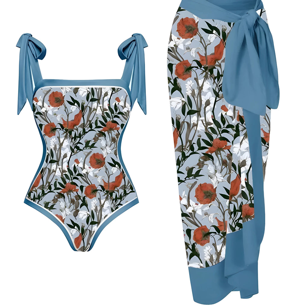 Women's floral print two-piece swimsuit with a sheer black chiffon hip skirt overlay.
