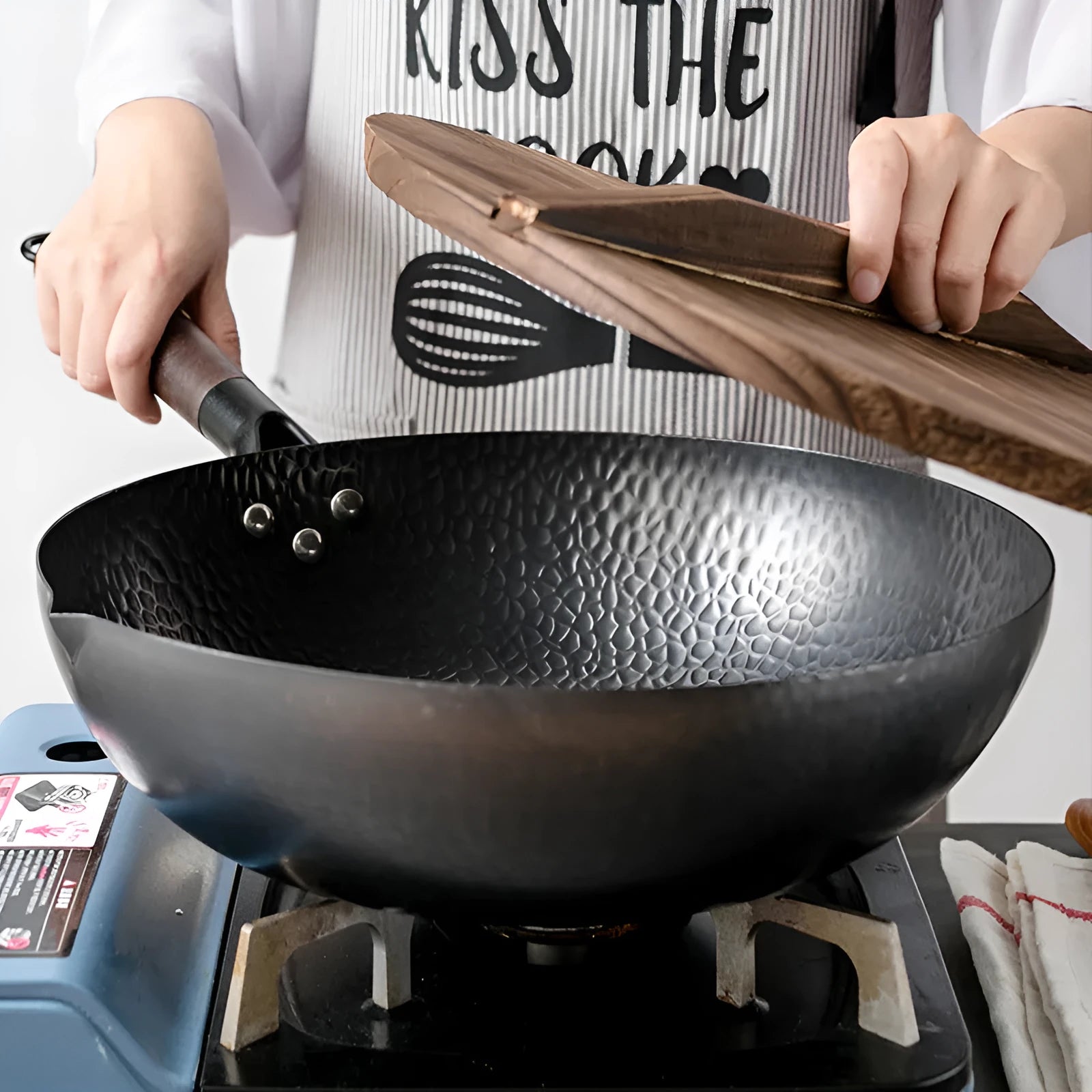 Traditional black iron wok with wooden handle, 40cm diameter.