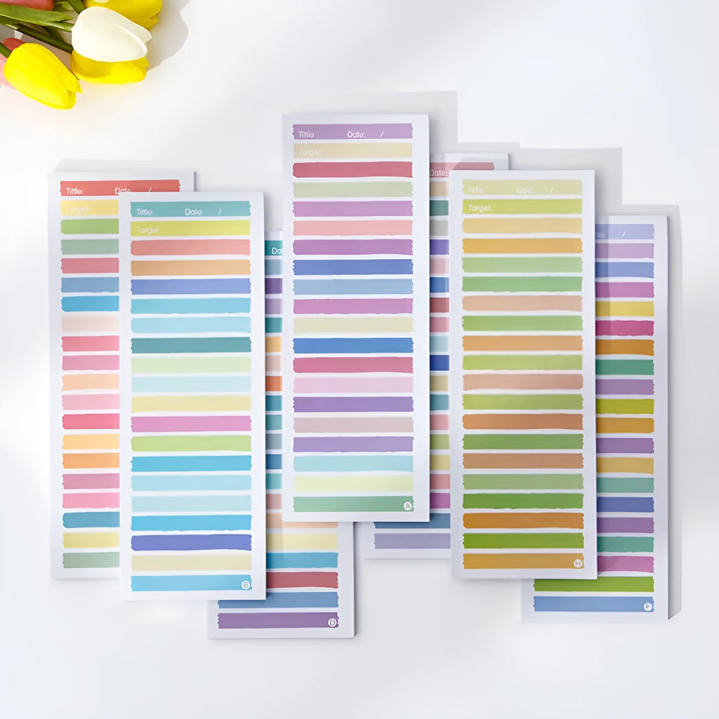 Cartoon student notepad in plastic storage box showing colourful striped and bear designs