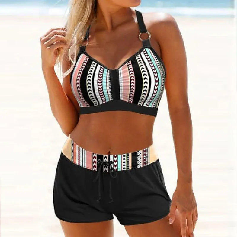 Women's two-piece print bikini swimsuit in polyester fabric shown in S M L XL sizes.