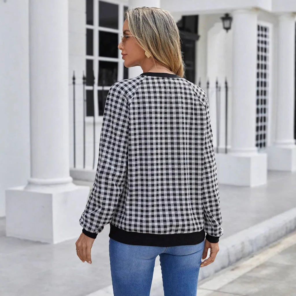 Black plaid pullover sweater with long sleeves and Japanese-inspired printed pattern