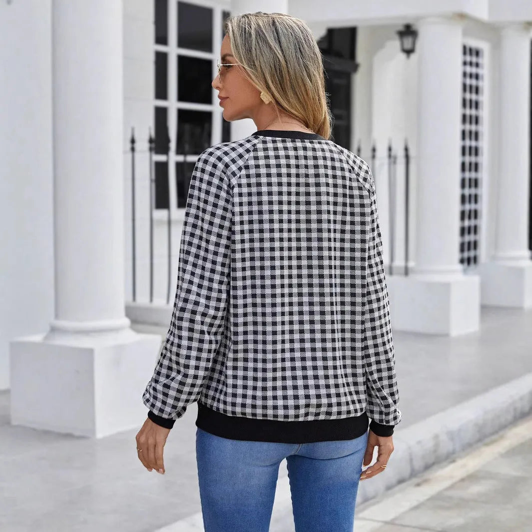 Black plaid pullover sweater with long sleeves and Japanese-inspired printed pattern