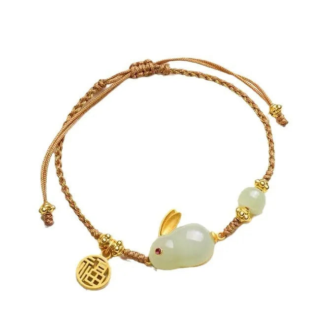 Yellow string bracelet with a geometric Hetian jade rabbit charm for women.