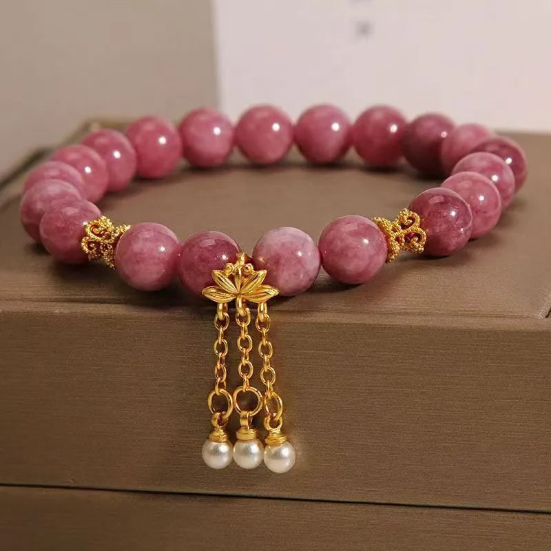 Natural stone bracelet with pink lotus tassel and pearl pendant bead in New Chinese style