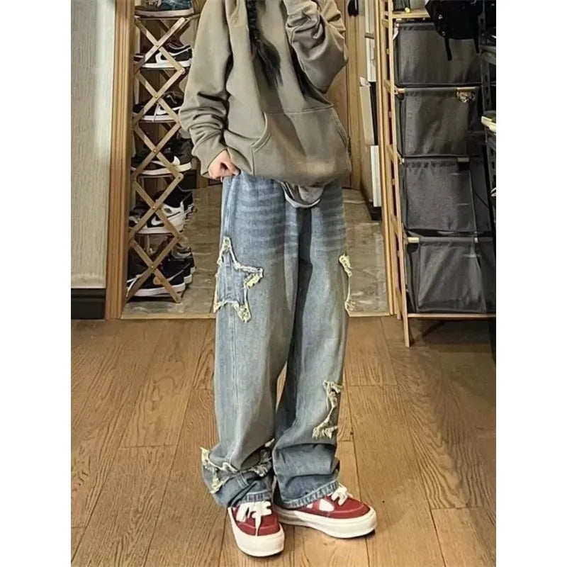 Blue high-waist women's wide-leg jeans made from cotton denim fabric on a neutral background.