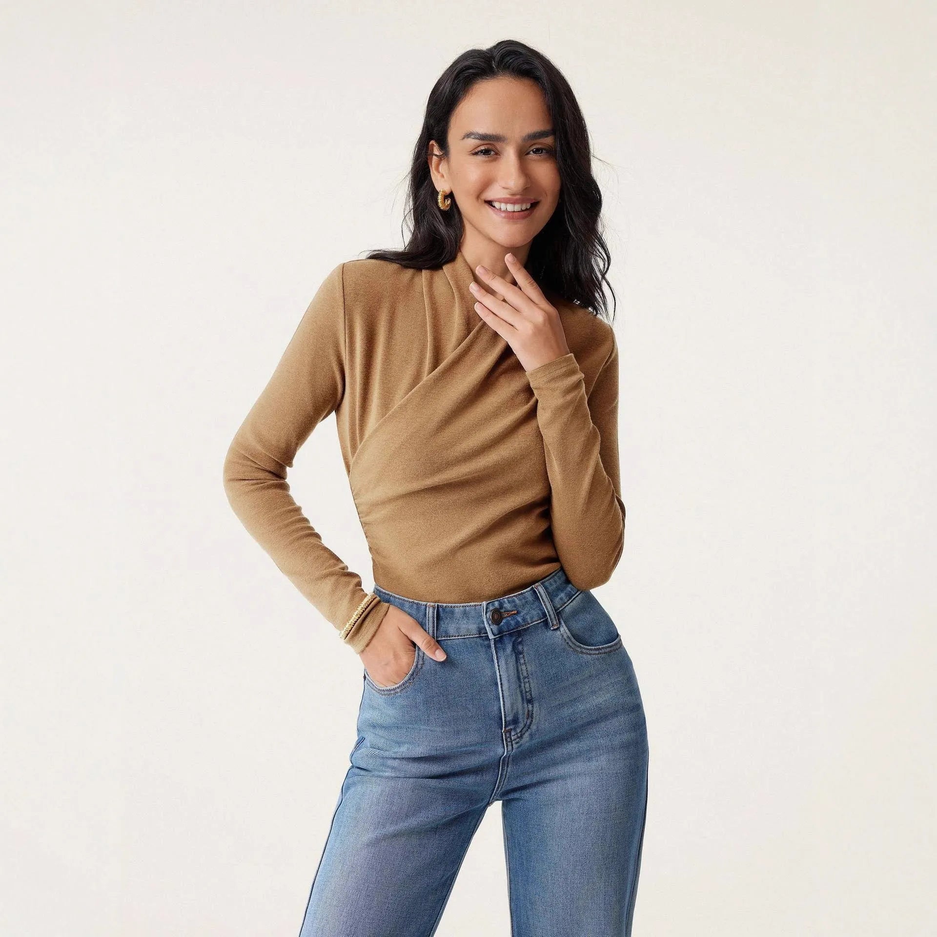 Camel coloured slim fit women's pullover sweater with long sleeves on hanger