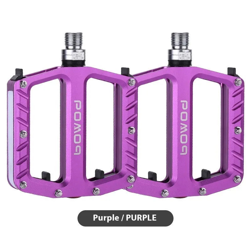 Bicycle pedal with integrated LED lights in aluminium alloy construction showing colour options