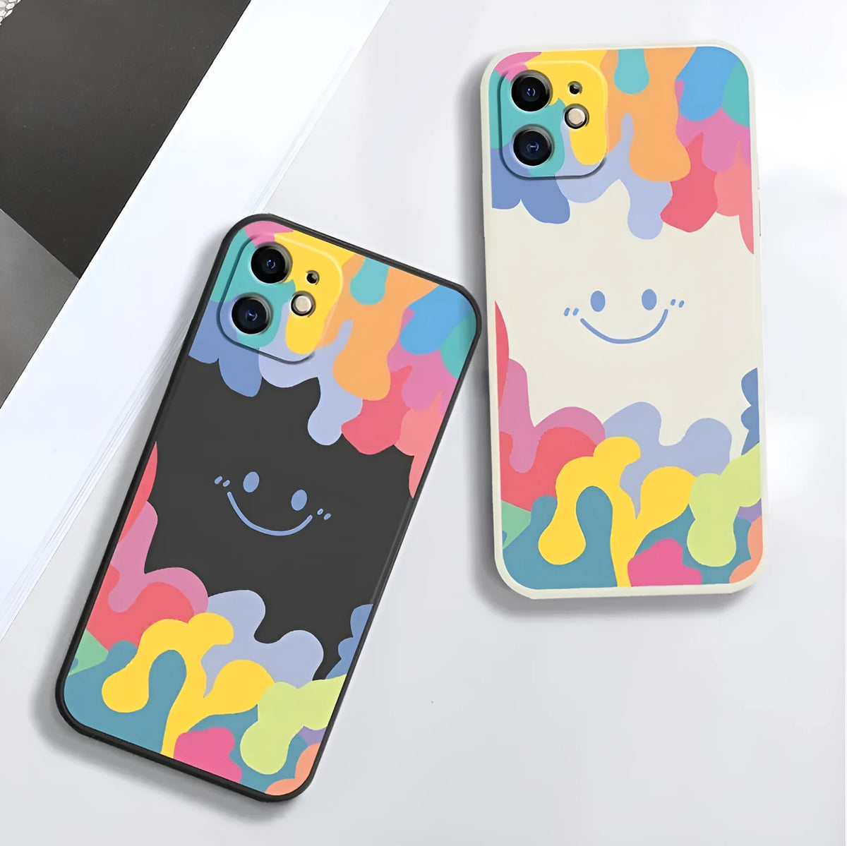 Rainbow smiley face print TPU phone case with attached lanyard in white or black colour options