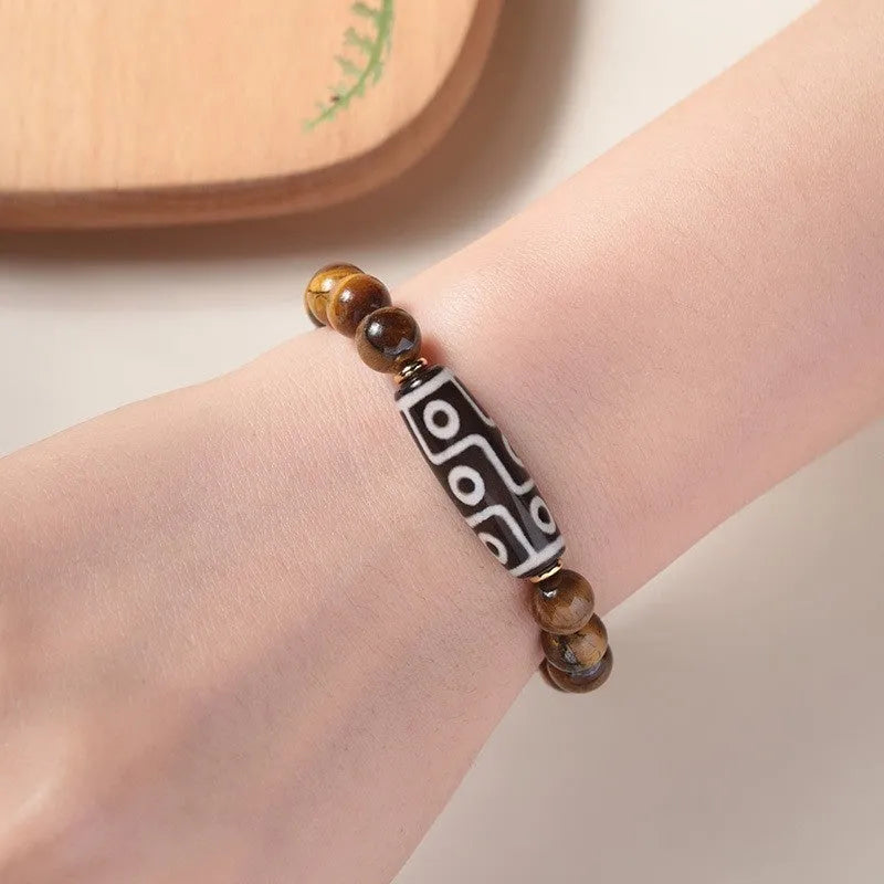 Tigereye stone Buddha bracelet with single circle rosary design showing natural banded patterns on beads