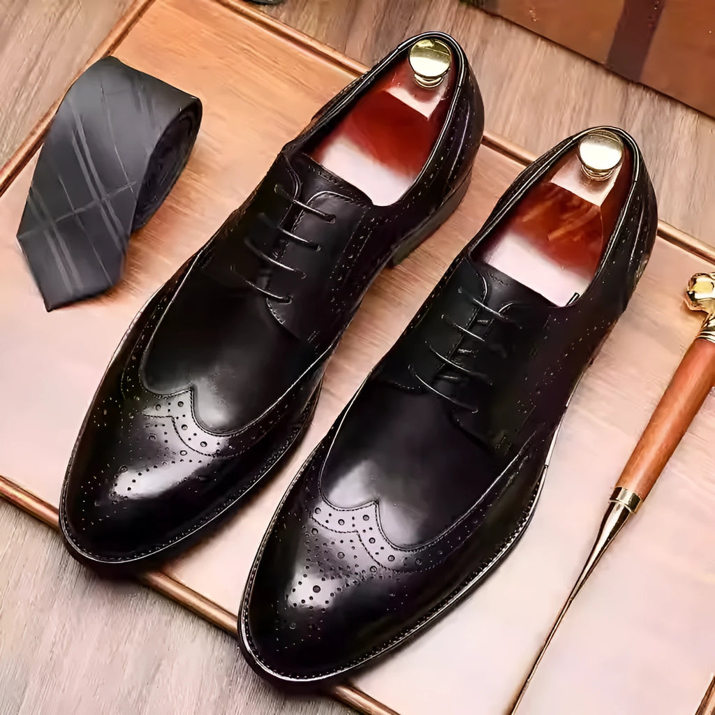 Men's pointed toe brogue formal shoes in black leather with carved patterns and low heel