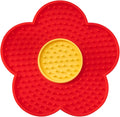 Flower-shaped blue silicone pet lick mat with suction cups on a tiled floor.