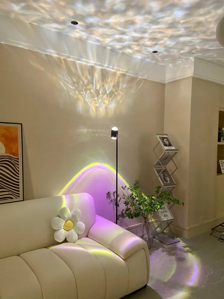 Modern sunset red floor lamp projecting a water ripple pattern on a wall.
