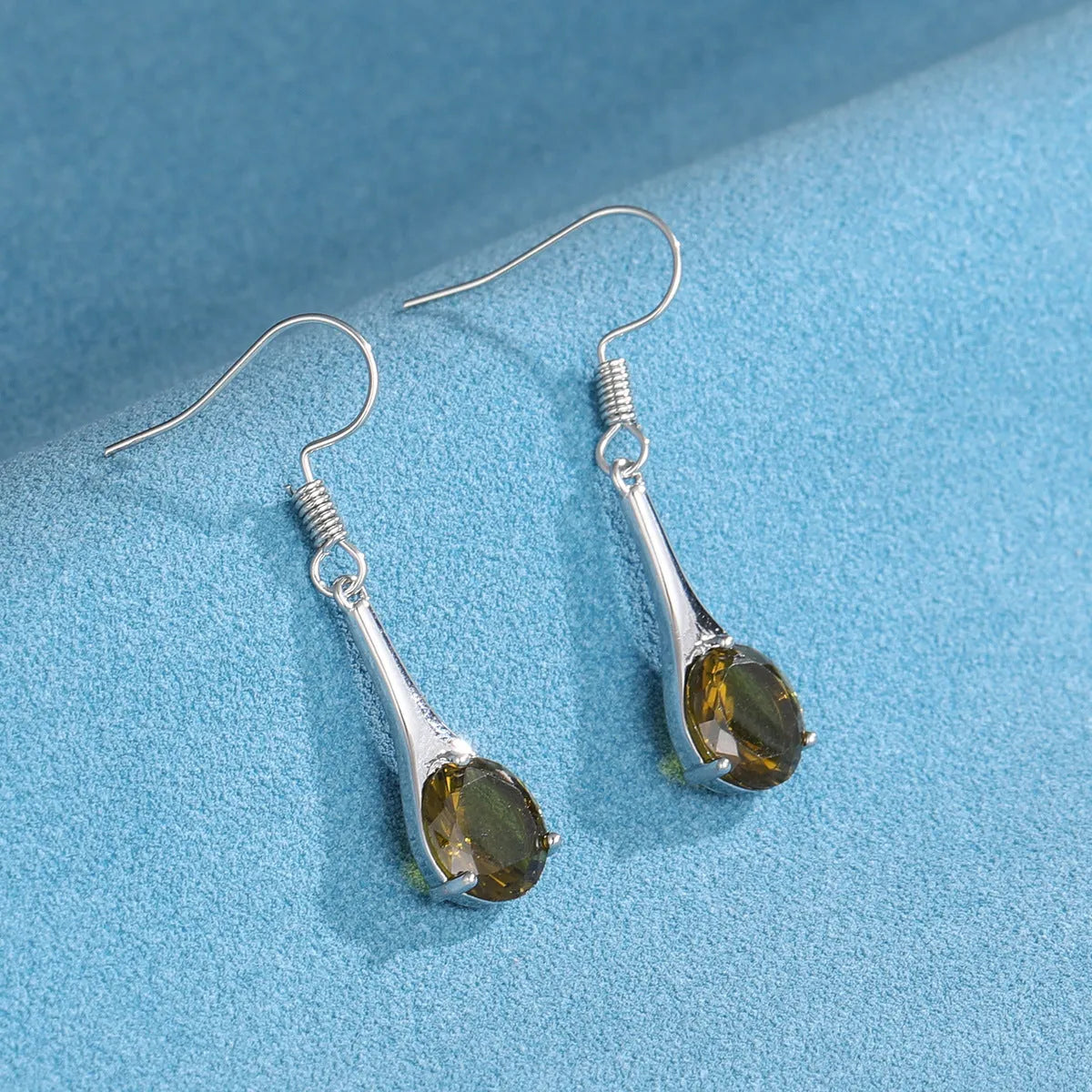 Olive green topaz water drop shaped earrings with retro design and minimalist styling