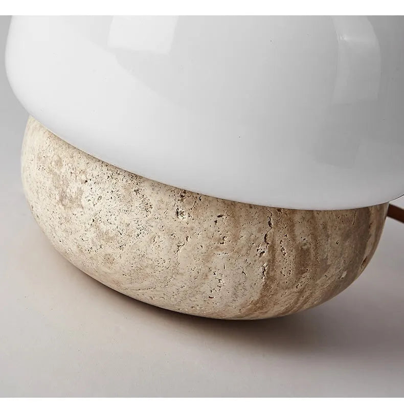 Cream coloured retro ceramic bedside lamp with a globe fabric shade and button switch.