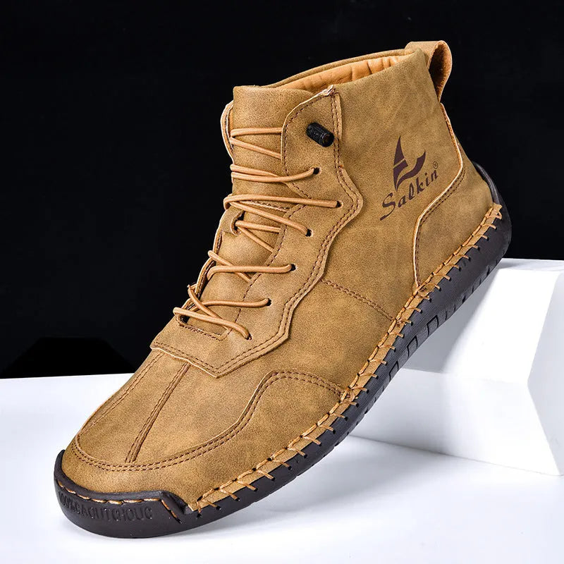 Men's dark blue retro high-top casual boots with lace-up front and elastic band on a white background.