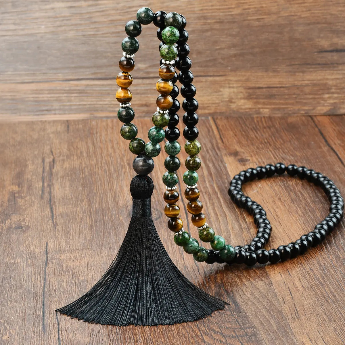 Handmade long beaded necklace with gemstone pendant and tassel, showing 81cm+ length.