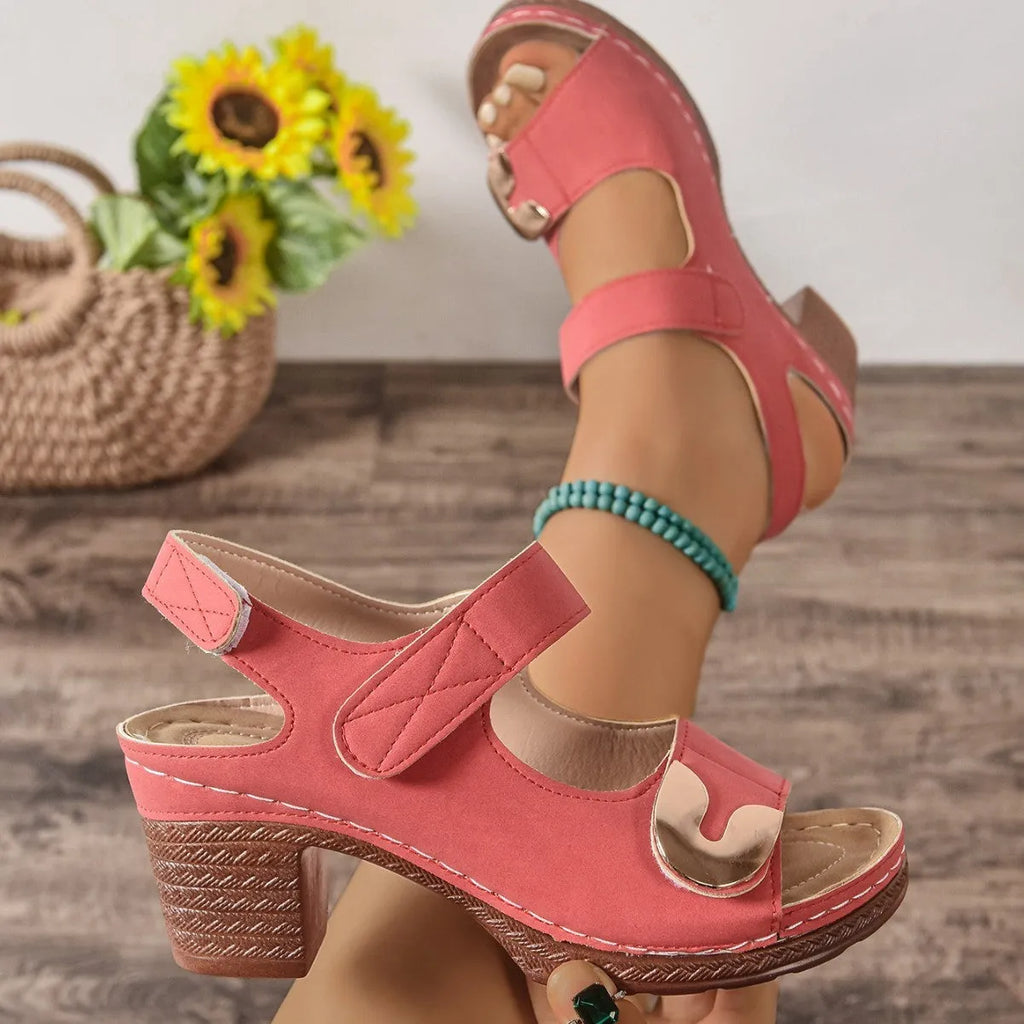 Women's light brown Roman sandals with Velcro strap fastening on a rubber sole.