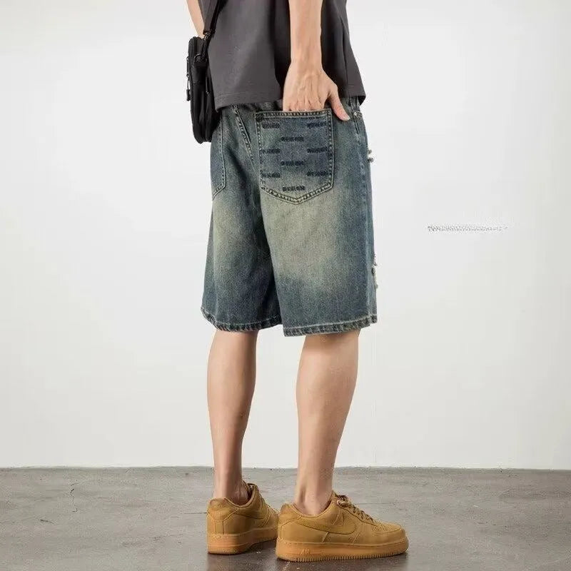 Blue retro distressed denim men's shorts with loose hole detailing and straight cut