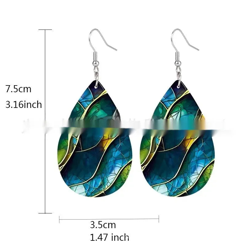 A pair of flat branch knot design drop earrings made from printed acrylic on a white background.