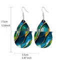 A pair of flat branch knot design drop earrings made from printed acrylic on a white background.