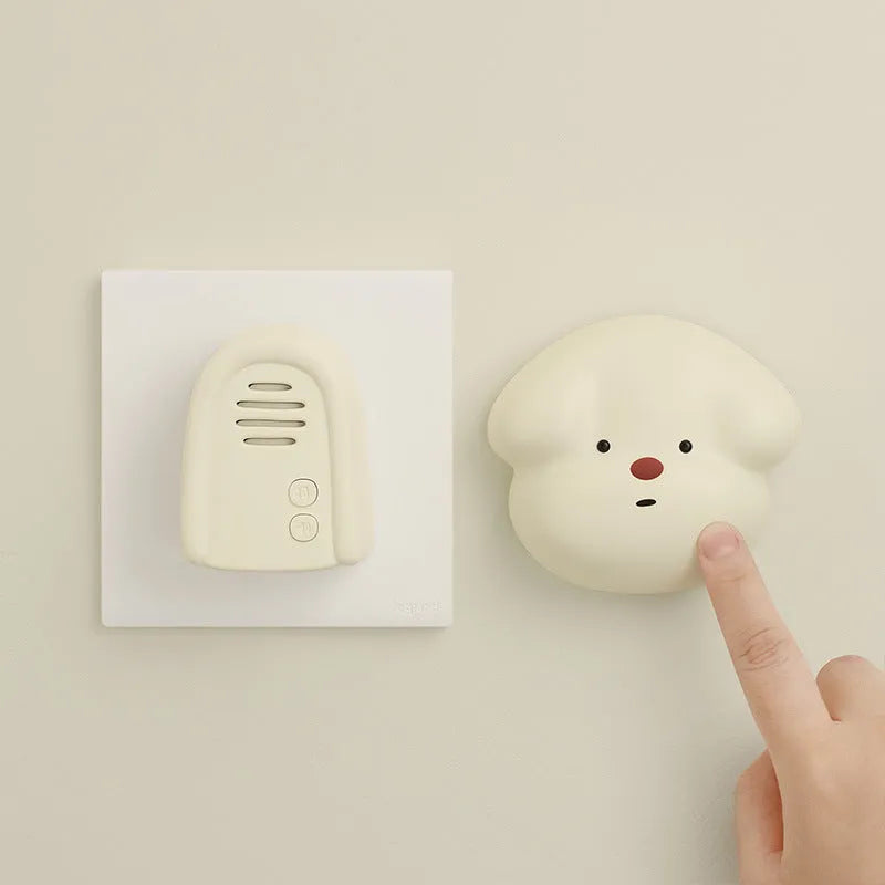 Household wireless plug-in doorbell in milky yellow or white colour