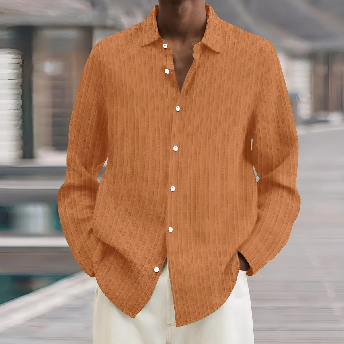 British-style loose fit men's striped long sleeve cardigan shirt on a hanger.
