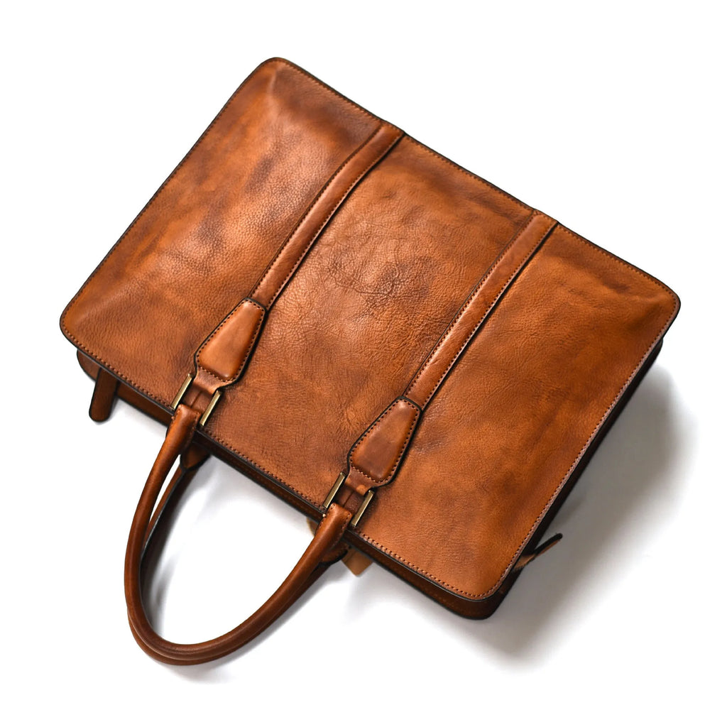 Men's brown leather horizontal square handbag with zipper opening showing 14 inch size