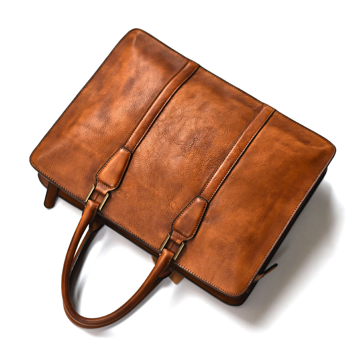 Men's brown leather horizontal square handbag with zipper opening showing 14 inch size