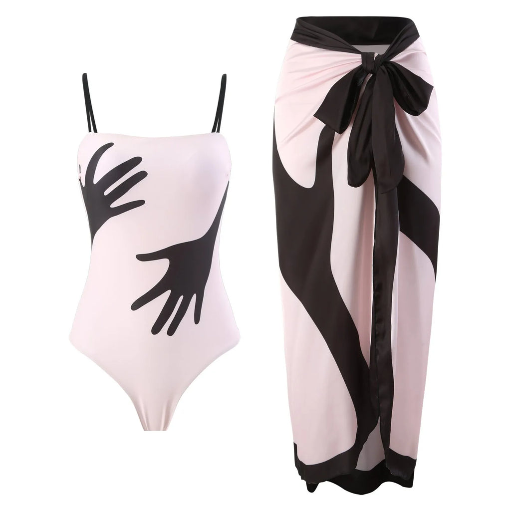 Women's patterned polyester bikini swimsuit with a long attached tulle skirt overlay.