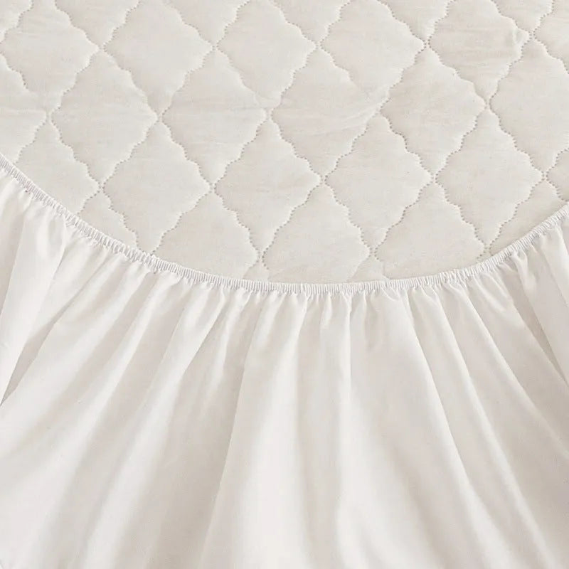 Diamond lattice quilted waterproof mattress protector set with fitted sheet and pillowcases in solid colour.