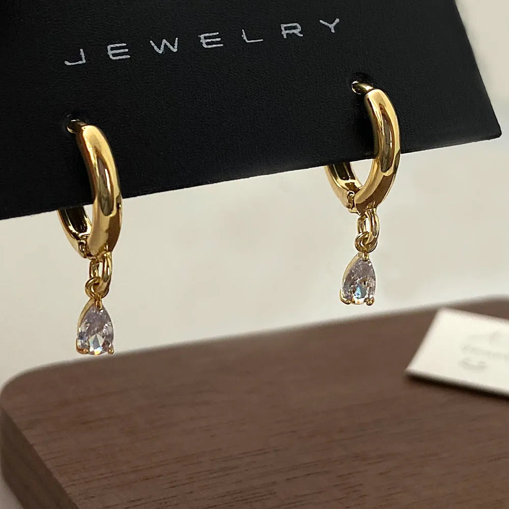 Women's zircon jewellery set showing necklace, earrings, and anklet with geometric meteor shower design