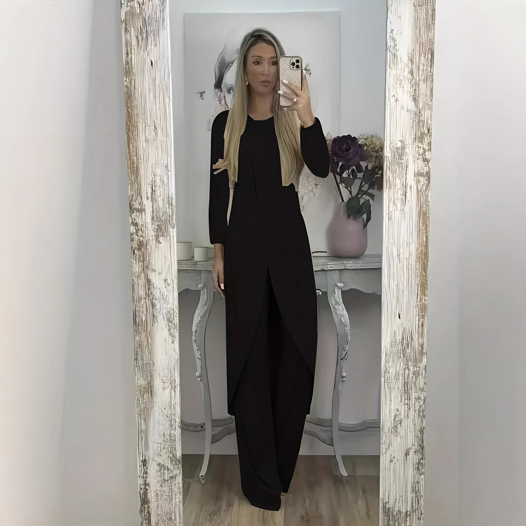 Casual black polyester two-piece tracksuit set with long sleeves and loose-fit trousers.