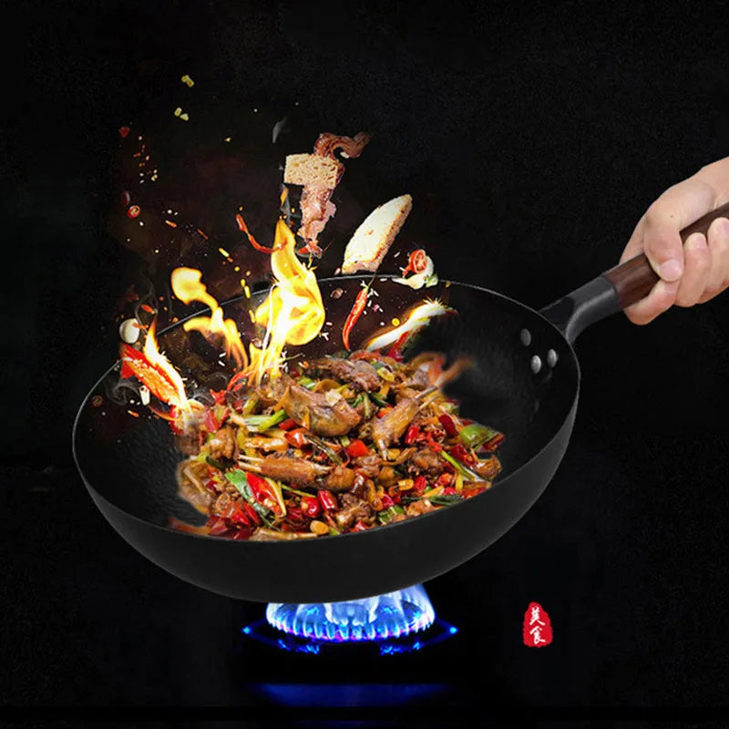 Traditional black iron wok with wooden handle, 40cm diameter.