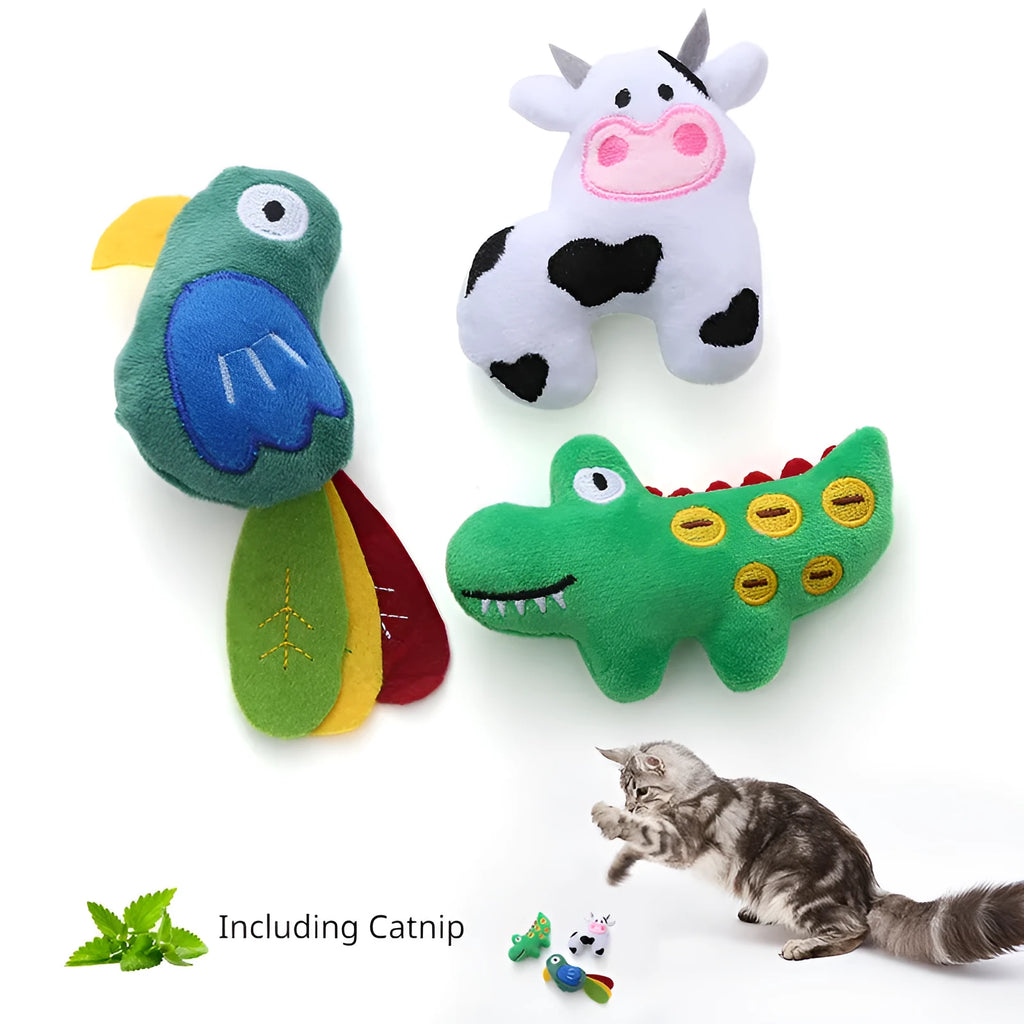 Plush cat toy in shape of a cow, a crocodile, and a parrot on a plain background.