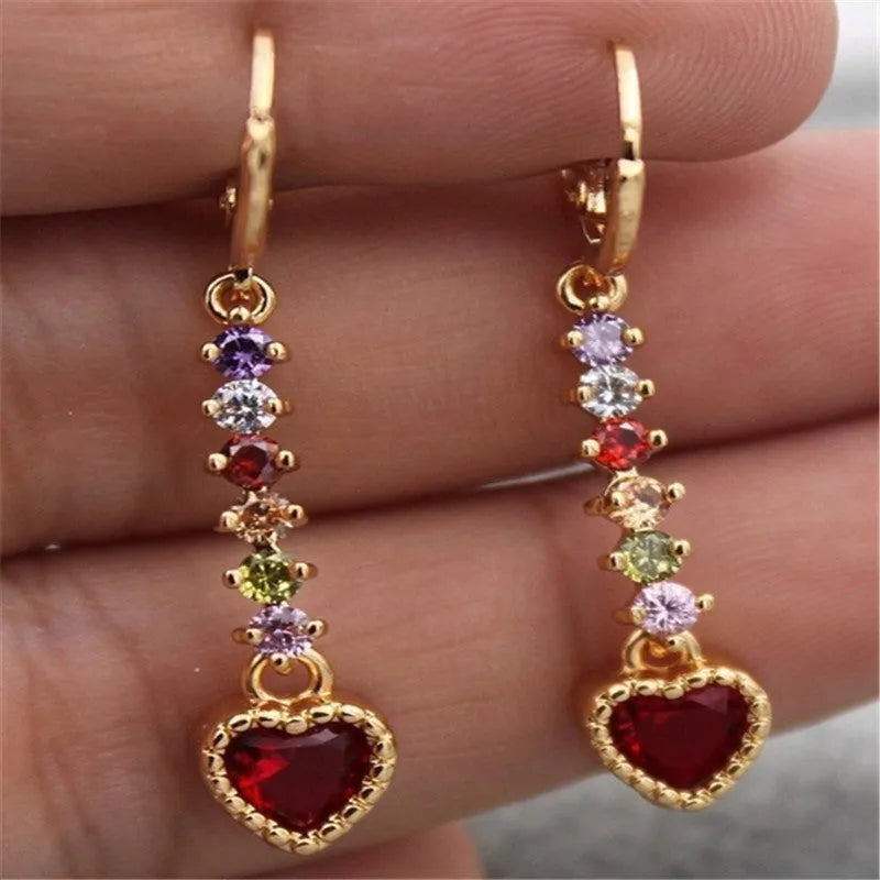 A pair of women's heart-shaped alloy earrings with a gold or silver electroplated finish.