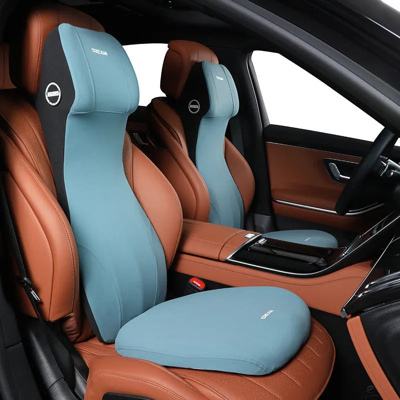 Black automotive memory foam seat cushion with integrated lumbar support headrest pillow.