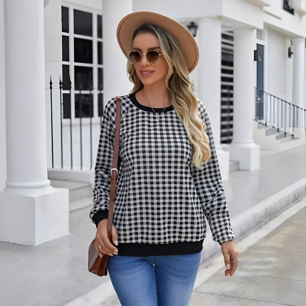 Black plaid pullover sweater with long sleeves and Japanese-inspired printed pattern