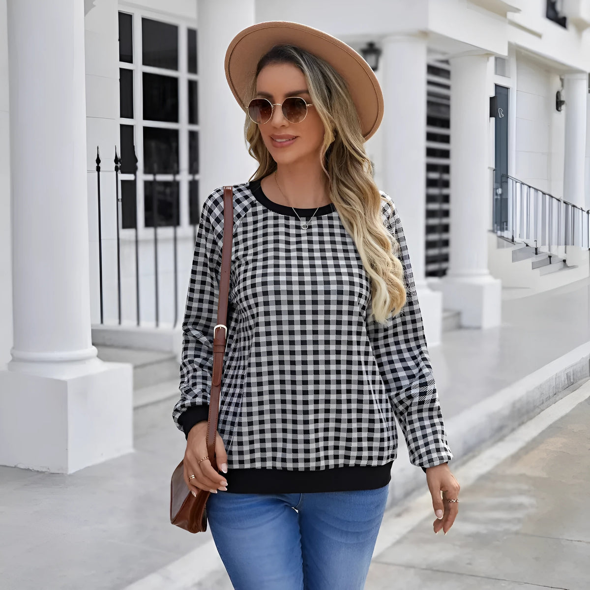 Black plaid pullover sweater with long sleeves and Japanese-inspired printed pattern