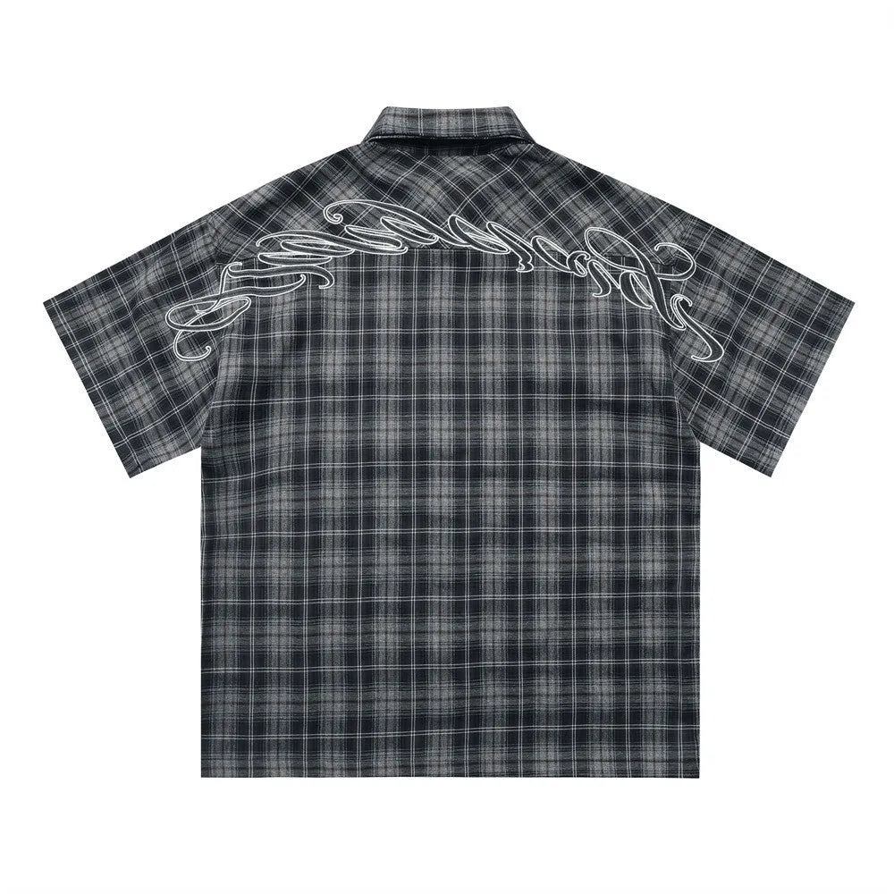 Men's black and brown plaid short sleeve shirt with embroidery detail and lapel collar