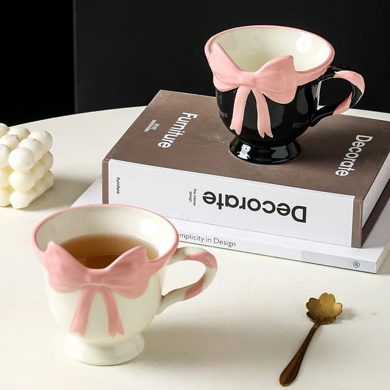 Ceramic heart bow design mug in white powder or black pink colour with 301-400ml capacity