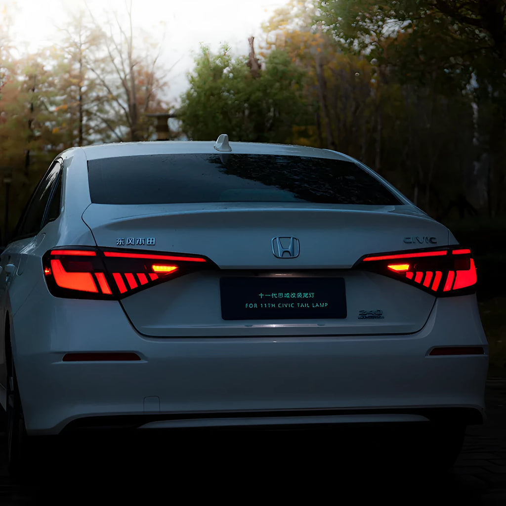 11th Generation Honda Civic black and red LED taillight assembly with sequential turn signals.