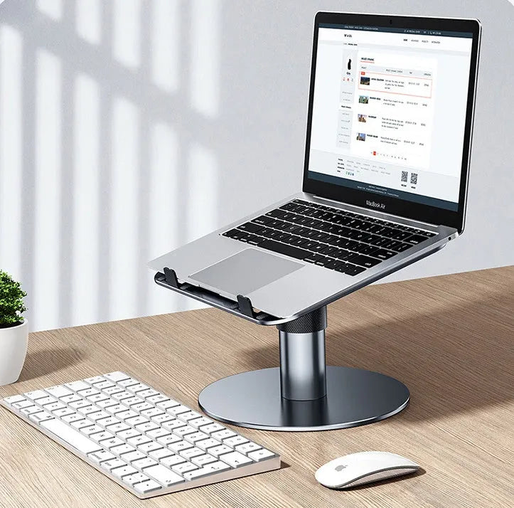 Silver adjustable aluminium car laptop stand extended on a car back seat.