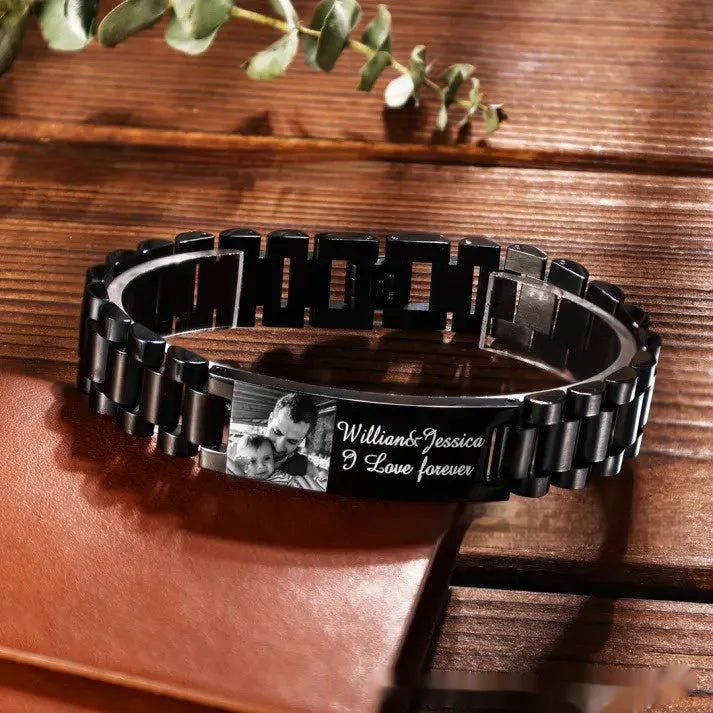 Titanium steel men's bracelet with curved heart shape and engraved lettering in black or grey finishes