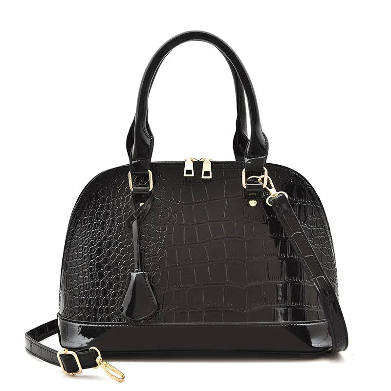 Glossy PU leather crossbody shoulder bag in shell shape with structured design