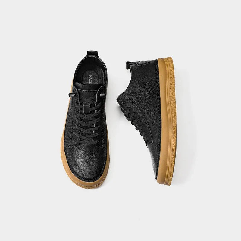 Men's black leather casual shoes with round toe and lace-up closure on rubber soles