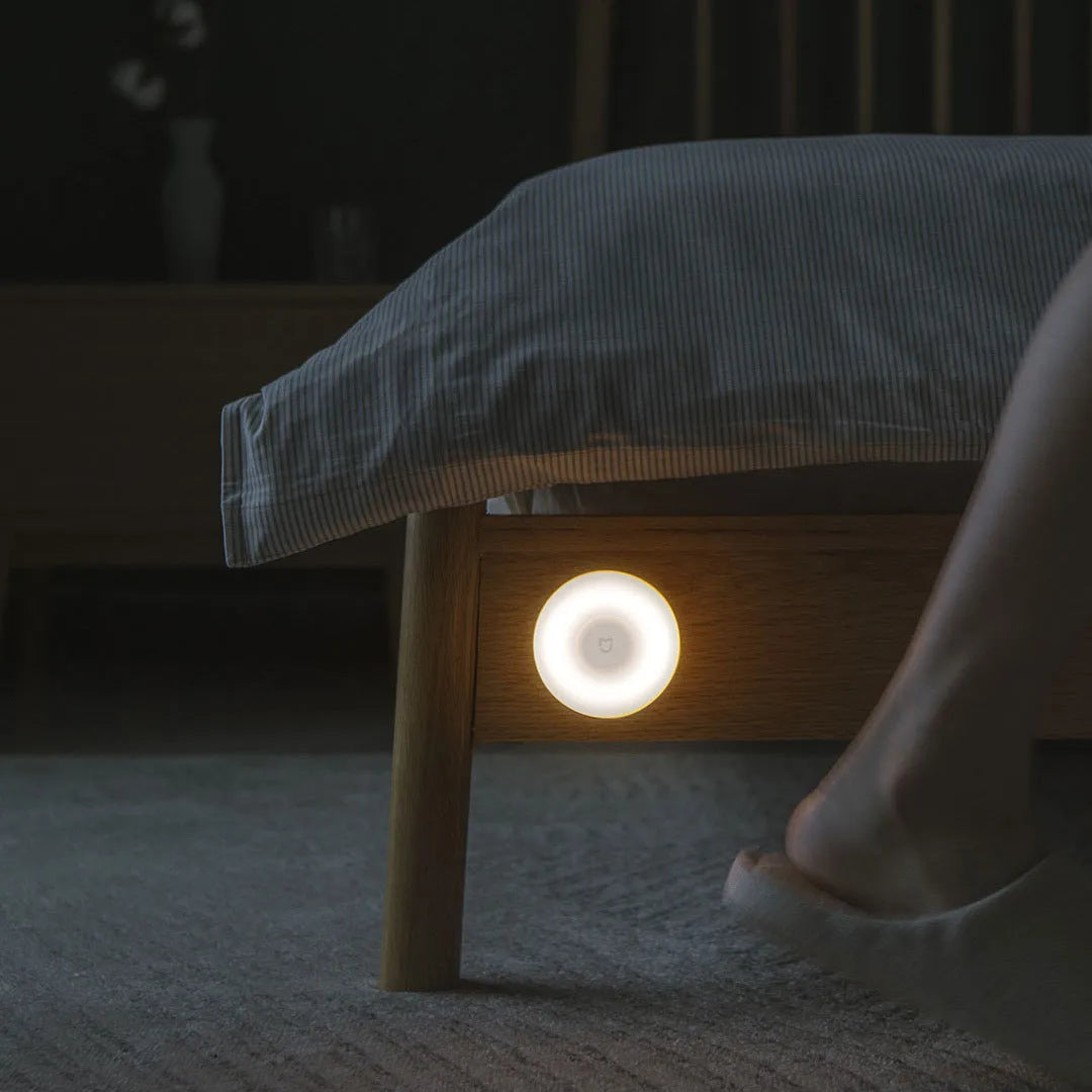 White modern bedside table lamp with Bluetooth and human body sensor.
