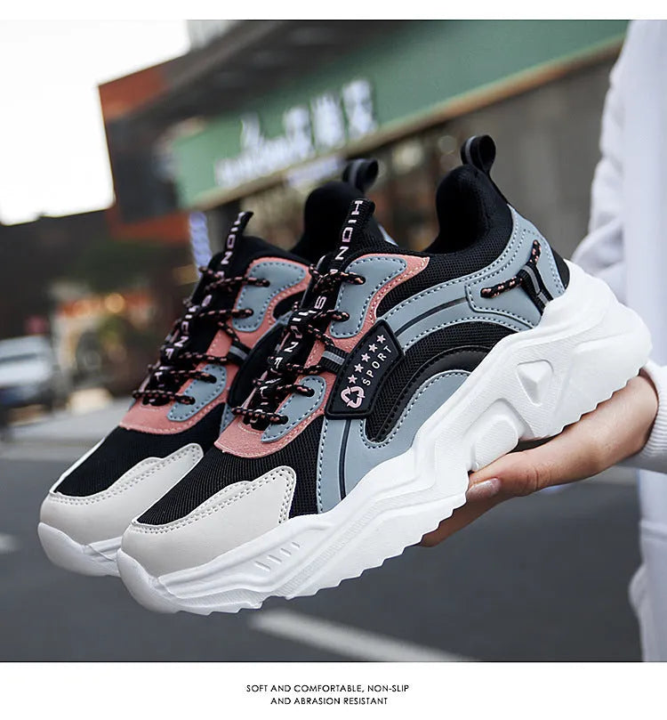 White women's casual sports shoes with mesh upper, thick PU sole, round toe, and buckle detail.
