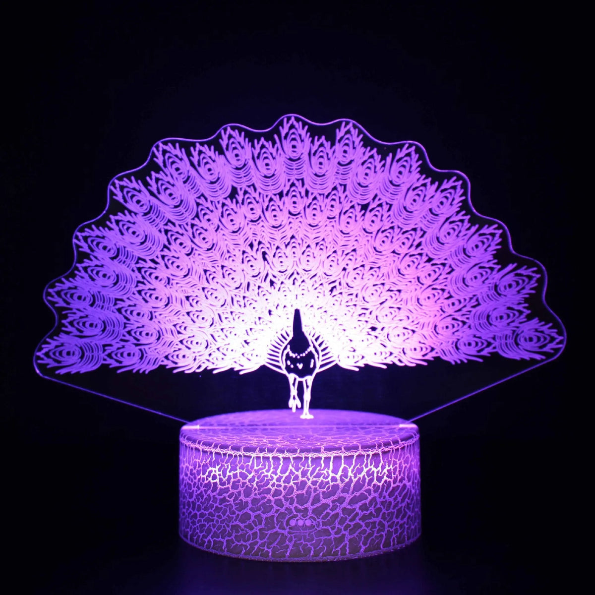 Small acrylic 3D touch-controlled USB table lamp with colourful crack-effect base on a desk.